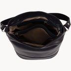 Blue leather handbag with a visible brand name on a white background