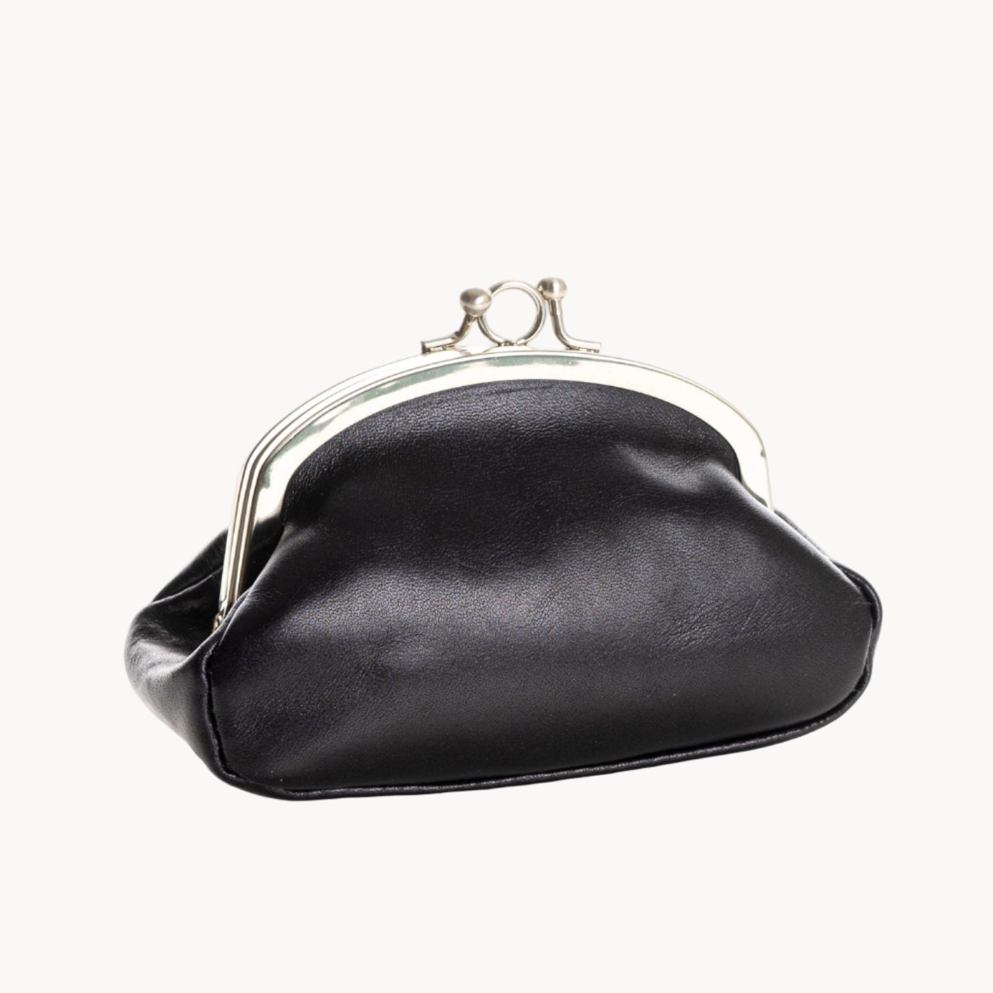 Black coin purse with a silver clasp on a white background