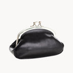 Black coin purse with a silver clasp on a white background
