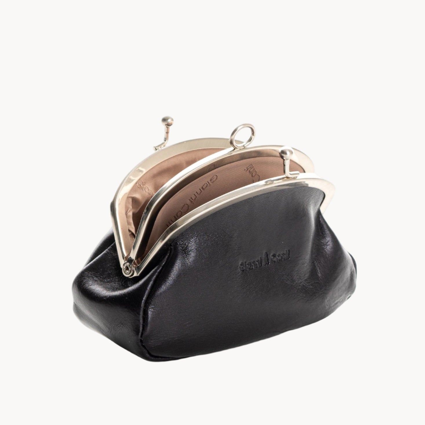 Black coin purse with gold clasp on a white background