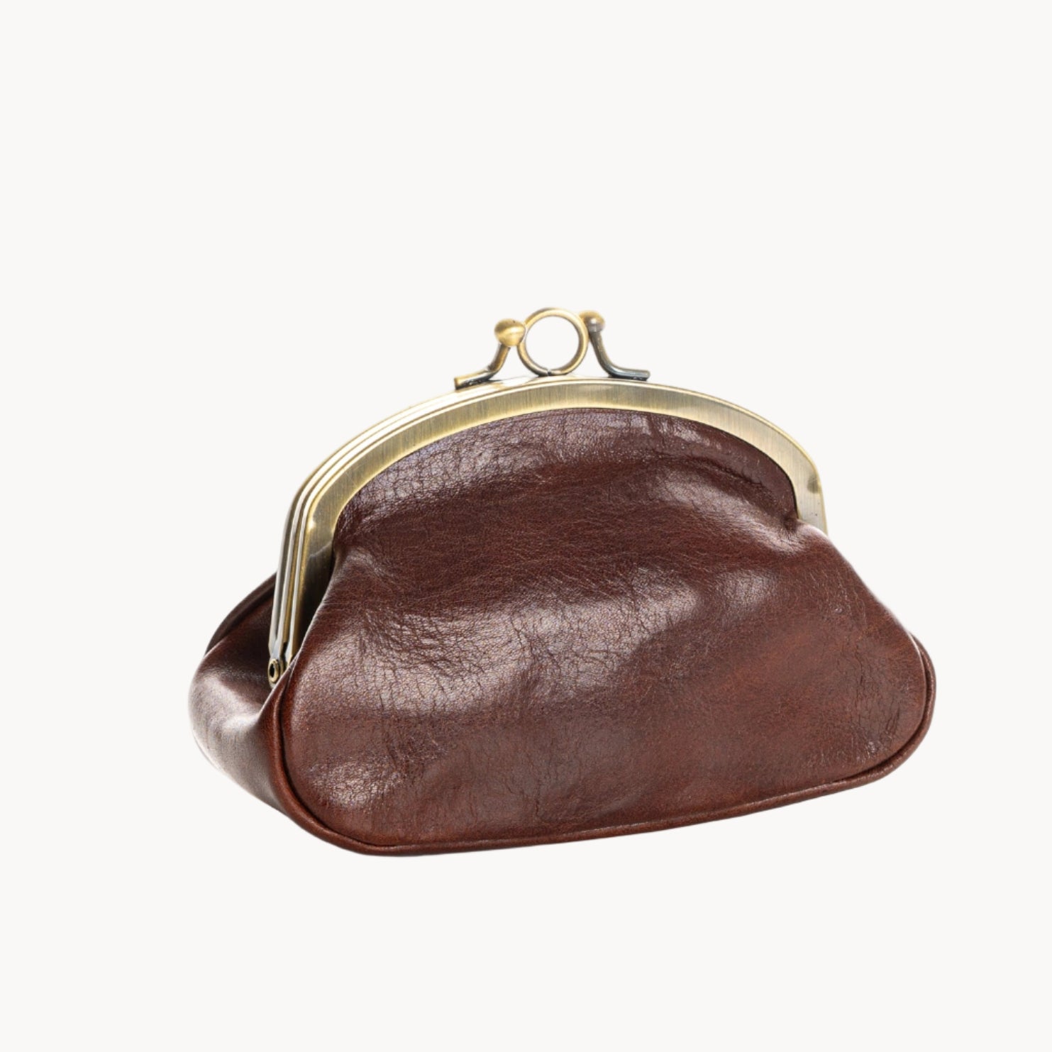 Brown leather coin purse with gold clasp on a white background