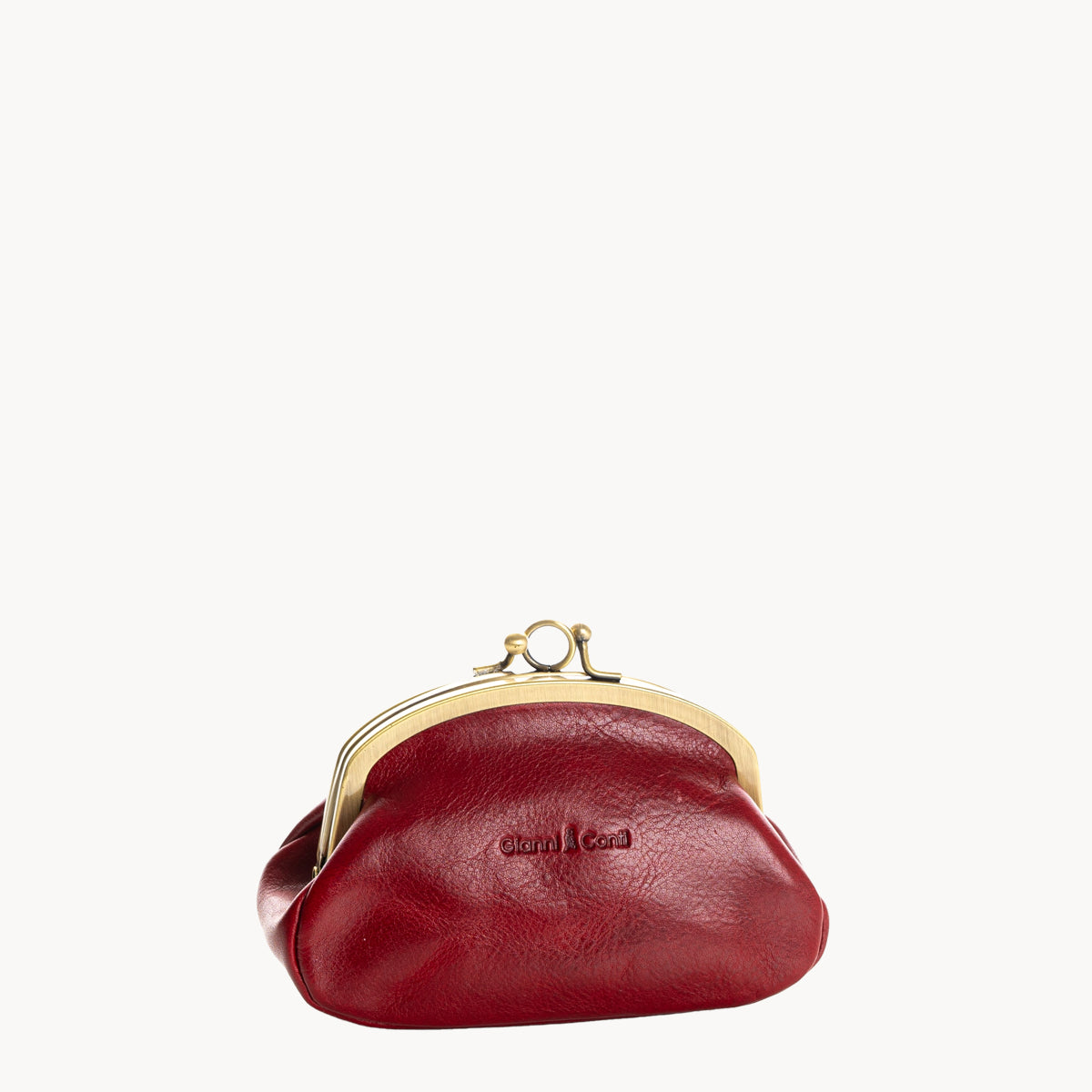 Red leather coin purse with gold clip clasp on a white background