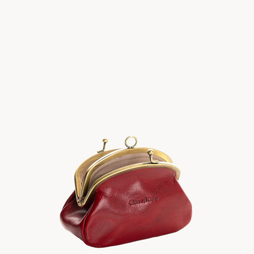Red leather coin purse with gold clip clasp on a white background