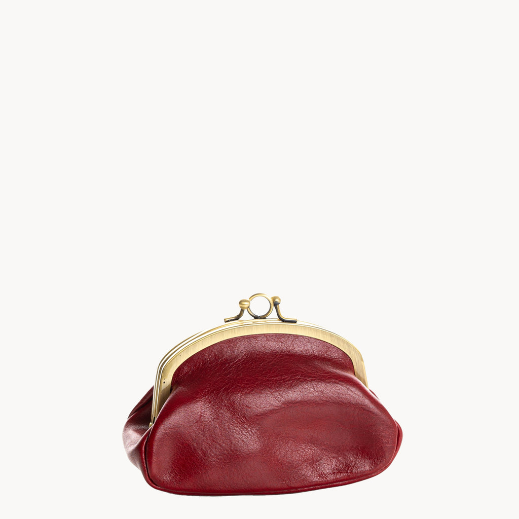 Red leather coin purse with gold clip clasp on a white background