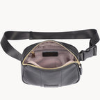 Black waist bag with a black strap on a white background
