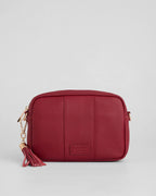 Burnt Rhubard red pebble leather crossbody bag with tassle and gold hardward