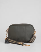 Volcano Grey pebble leather crossbody bag with tassle and gold hardward with interchangable fabric strap