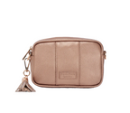 Bronze crossbody bag with a tassel charm on a white background