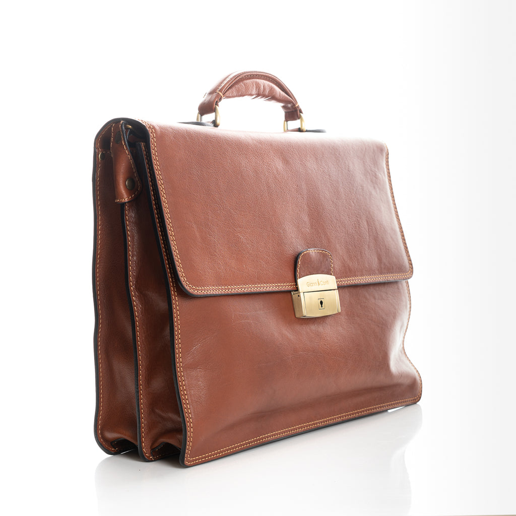 Tan leather briefcase with gold coloured front lock