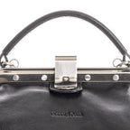 Close-up of black Italian leather handbag clasp detail