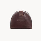 Brown leather coin purse with Gianni Conti branding on a white background