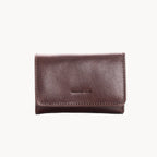 Brown leather wallet with brand name on a white background