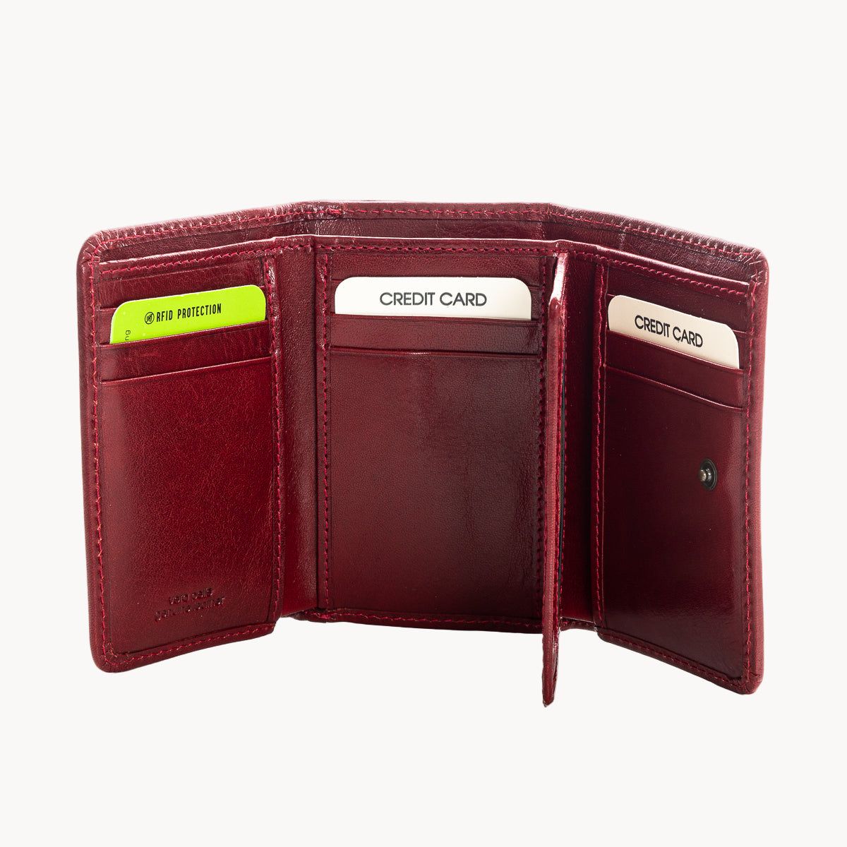 Open red leather wallet with card slots on a white background