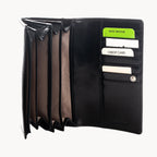 Black wallet with card slots and a green security tag on a white background