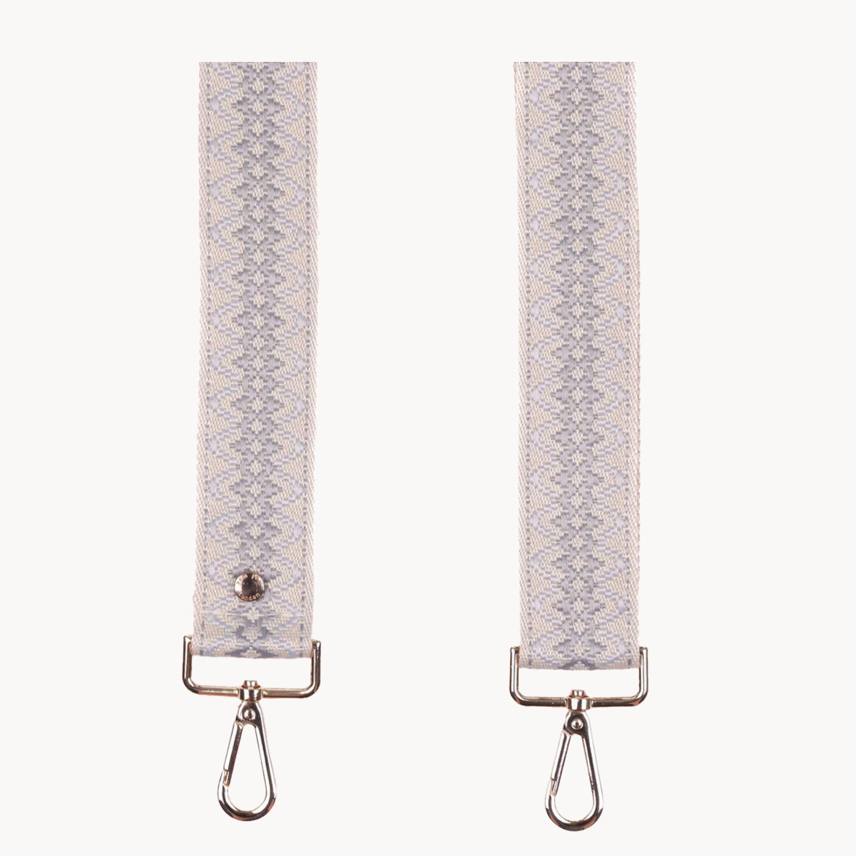 Grey fabric straps with metal hooks on a white background