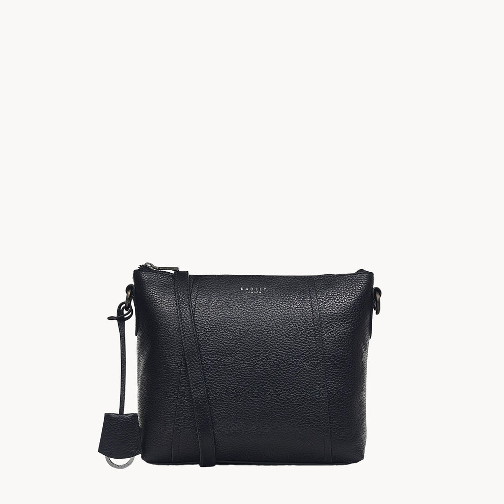 Black leather crossbody bag on a white background