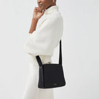 Radley Westwell Lane Medium Flapover Crossbody Bag in Black - lifestyle shot showing crossbody wear