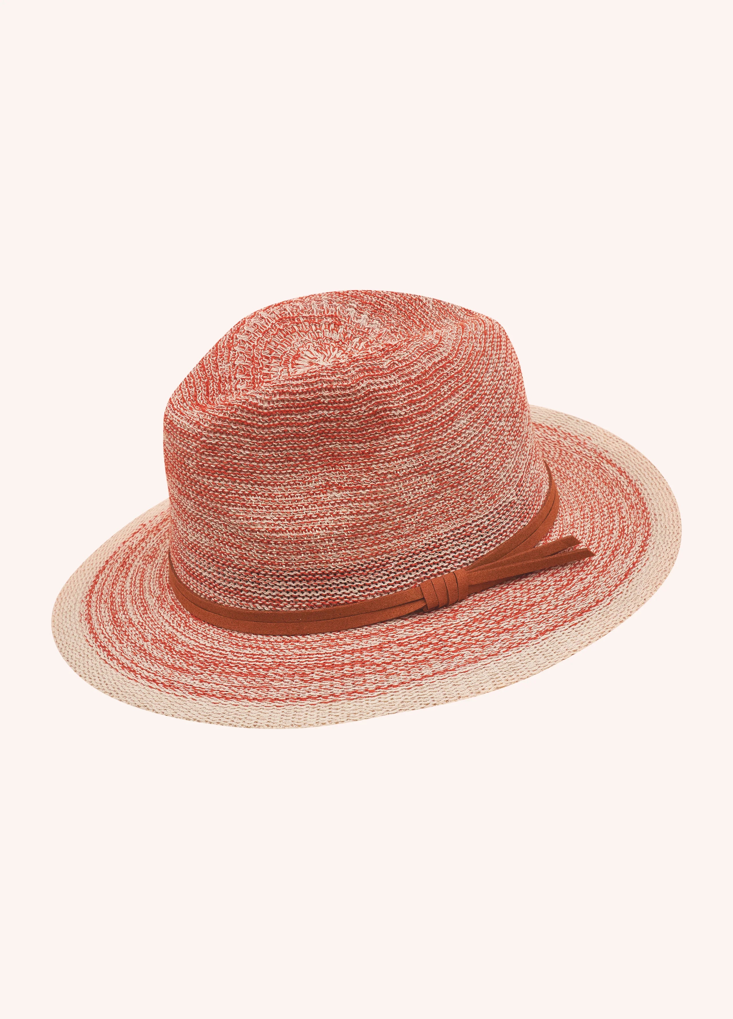 Red straw hat with a brown band on a white background