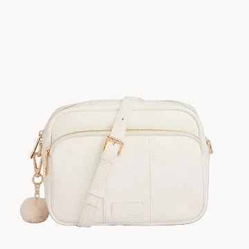 White leather handbag with gold accents on a light gray background