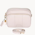 stone crossbody bag with gold accents on a white background
