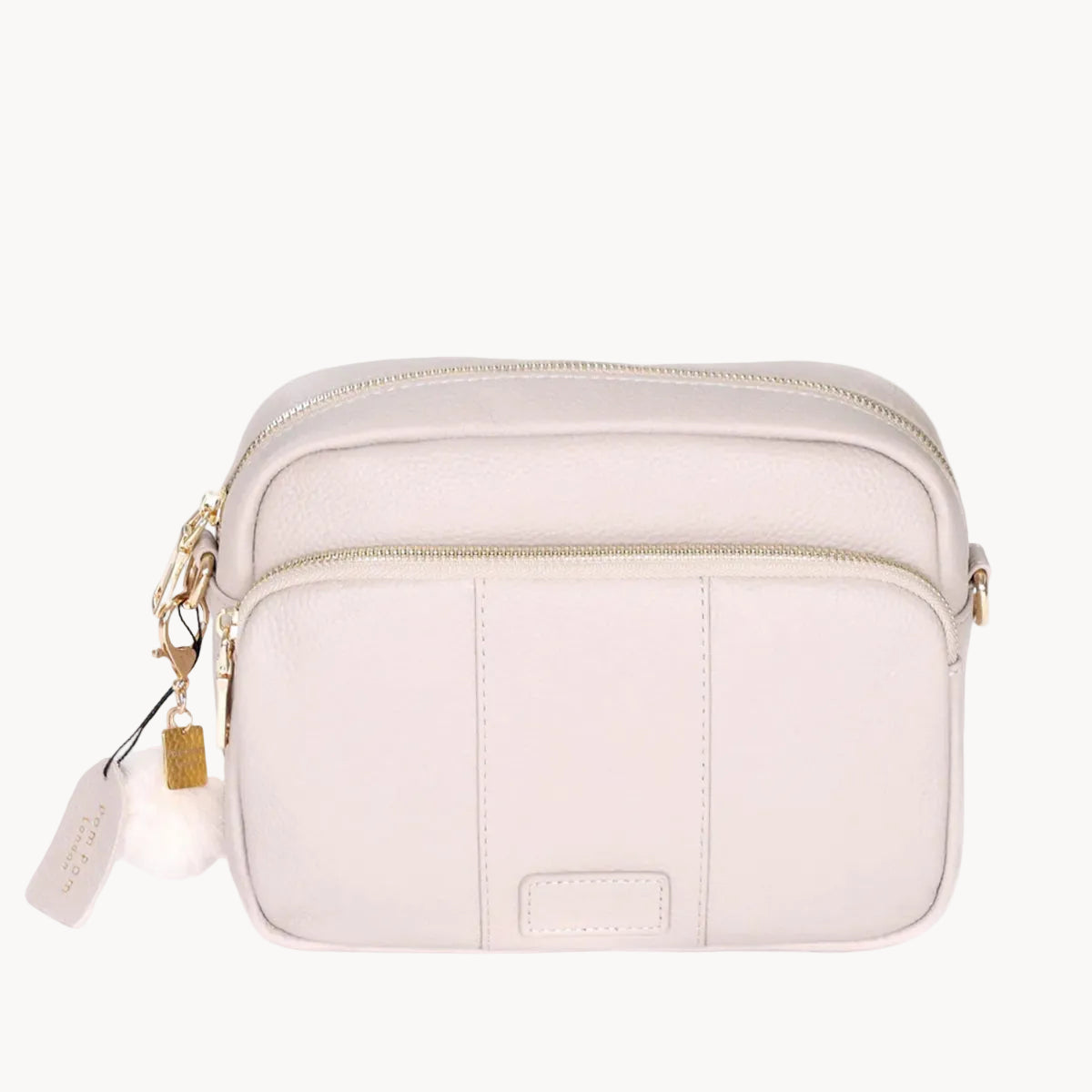 Stone  crossbody bag with gold zipper on a white background