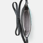 Black leather crossbody bag with a strap on a white background