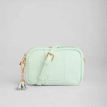 Mint green crossbody bag with a strap on a light gray background