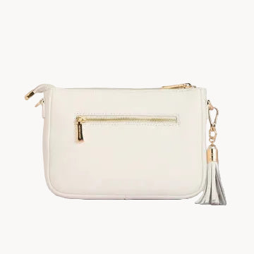 White handbag with gold accents on a light gray background