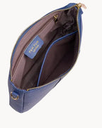 Blue handbag with gold zipper and hardware on a light gray background