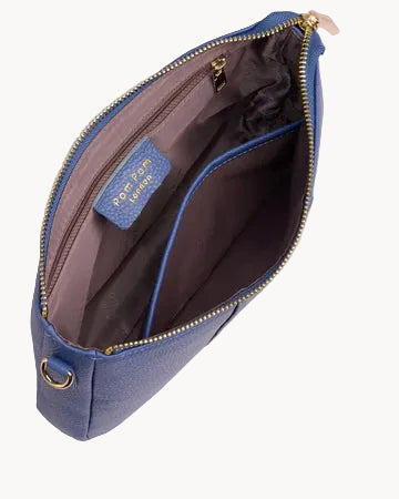 Blue handbag with gold zipper and hardware on a light gray background