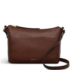 Brown leather shoulder bag with a visible brand name on a white background
