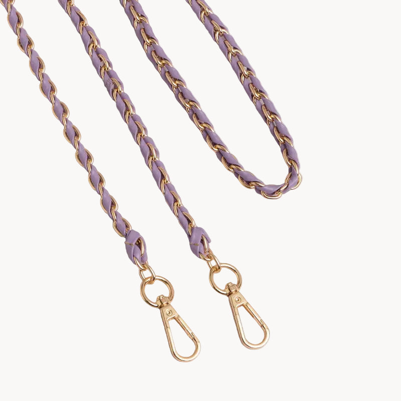 Purple and gold braided bag strap on a light gray background