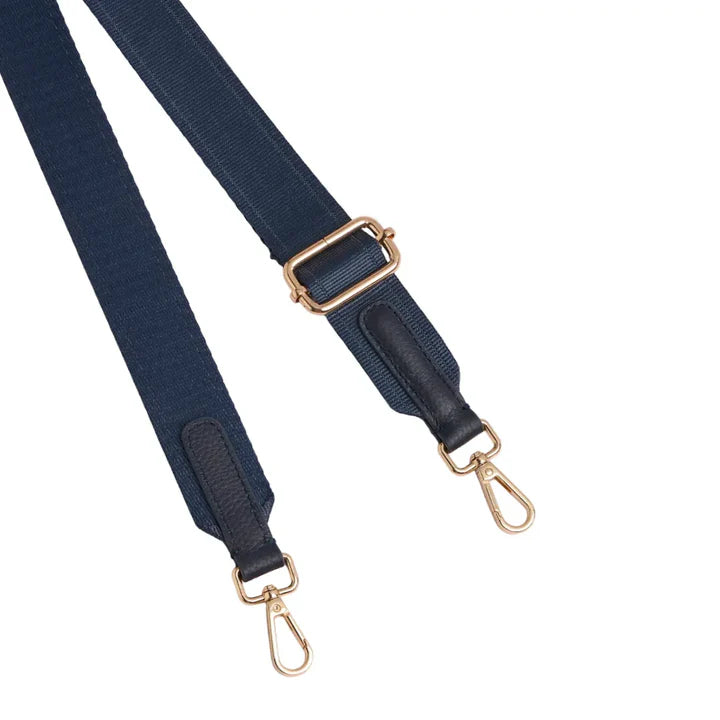 Navy blue strap with gold hardware on a white background
