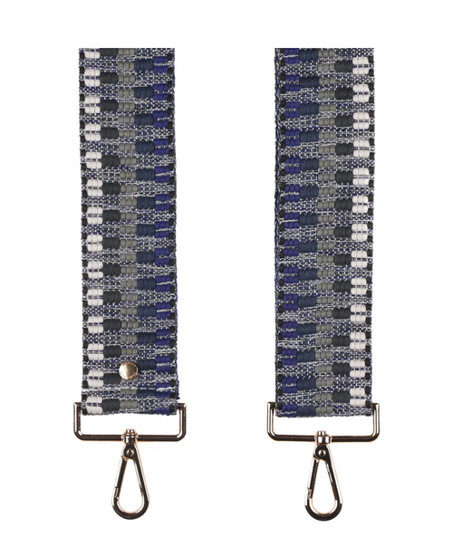 Patterned strap with metal hooks on a white background