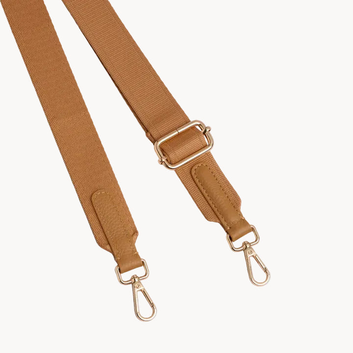 Maple bag strap with gold hardware on a light gray background