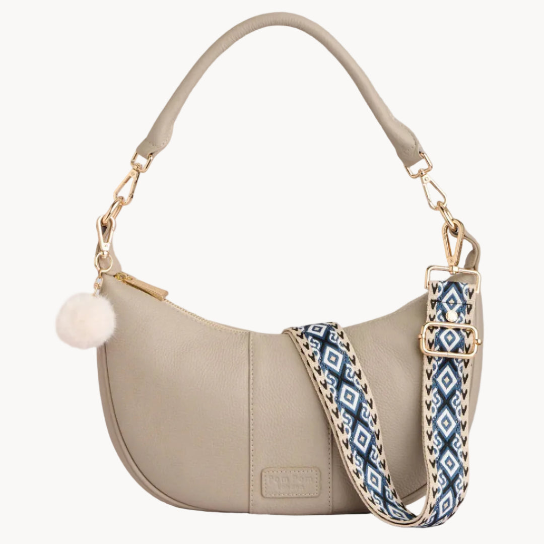Sonte handbag with a patterned strap on a gray background