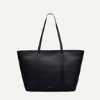 Black tote bag on a light gray background