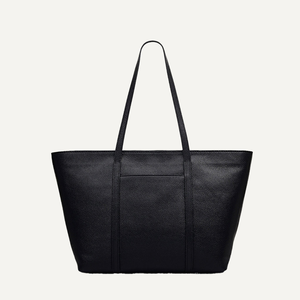 Black leather tote bag on a light gray background