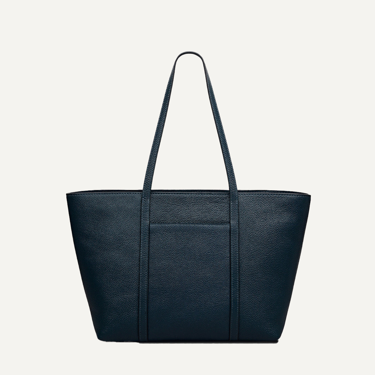Teal leather tote bag on a light gray background