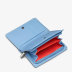 Blue leather bi-fold purse with appliqué flower and bee detail - inside view coin section with internal divide