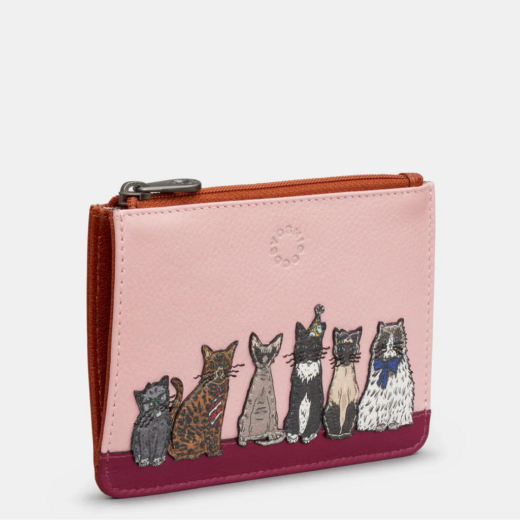 Pink wallet with cat illustrations on a white background