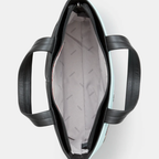 Black leather handbag with a patterned interior on a white background