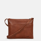 Brown leather crossbody bag on a light gray background
