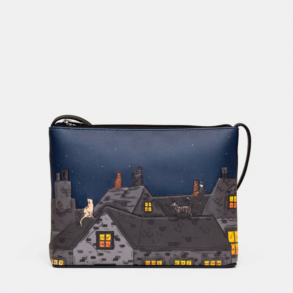 Crossbady bag with a cat design on a dark blue background
