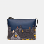 Crossbady bag with a cat design on a dark blue background