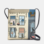 Crossbody bag with a design of cats looking out of windows on a building facade.