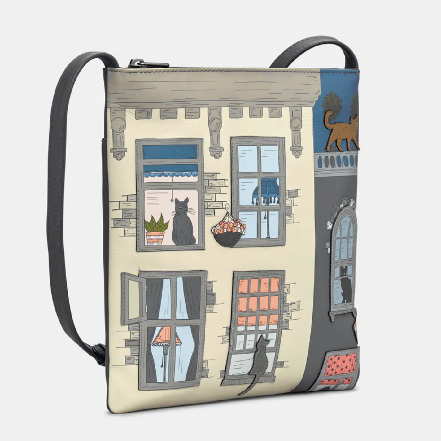 Crossbody bag with a design of cats by windows on a beige background