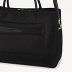 Black handbag with gold hardware on a white background