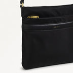 Black handbag with gold zipper on a white background