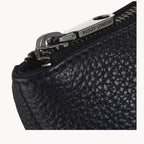 Black textured leather bag with a silver zipper featuring 'Radley London' branding.